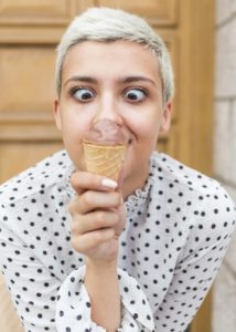 front-view-woman-enjoying-ice-cream_23-2148262897